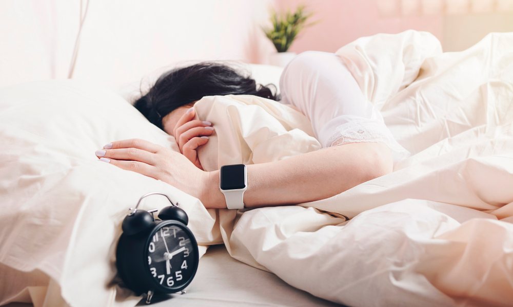 Woman Wearing Apple Watch In Bed